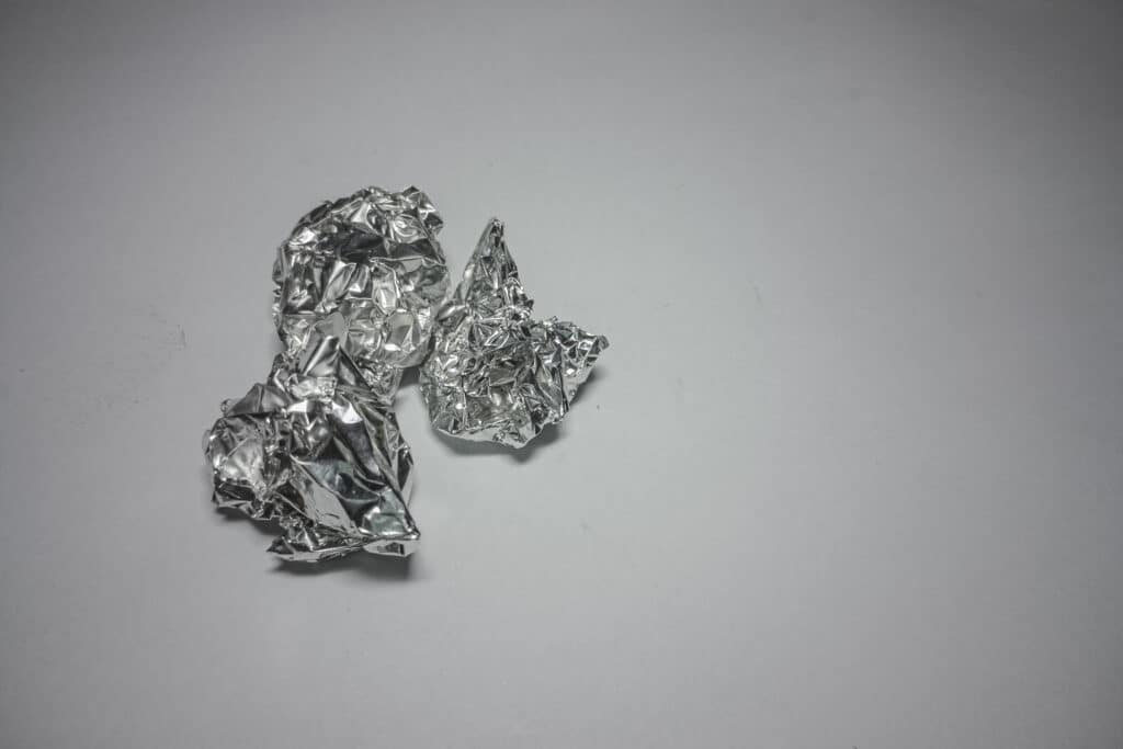 a sample of aluminium foil on a piece of paper